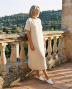 The Barely There Flats in Bone — worn on the terrace, warm daylight