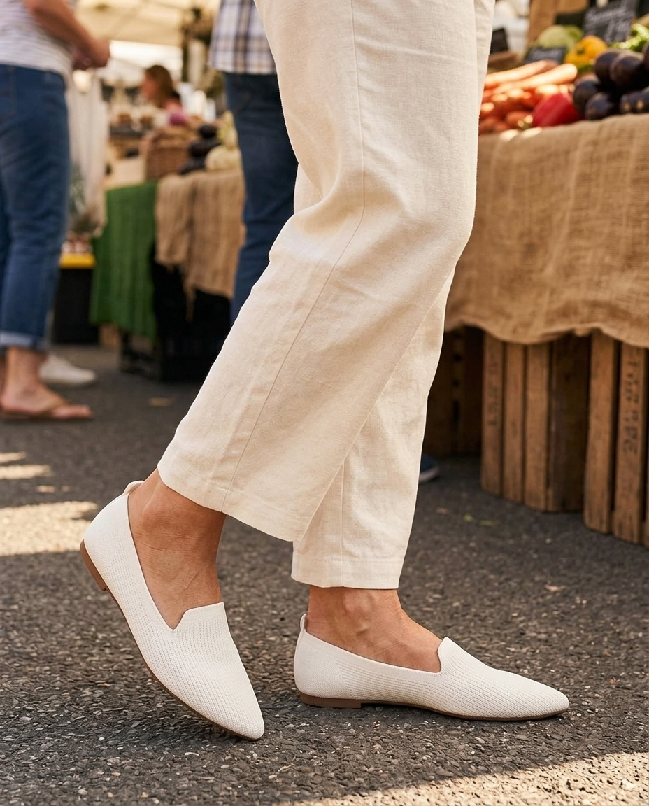 Mid-step at the market — the sole bends with the foot · unretouched