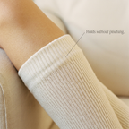 The wide top band — holds without pinching