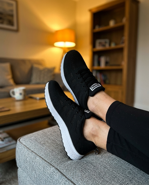 Black · feet up after a long day · unretouched